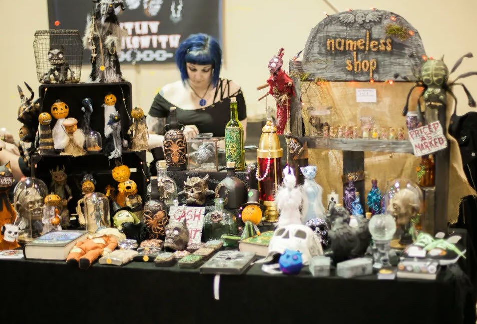 Photo of a table display of horror figurines at Oddities and Curiosities Expo