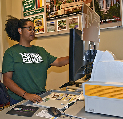 Photo of a student worker at the customer service counter of Union Station