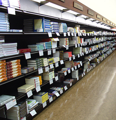 photo of textbook stacks in campus bookstore